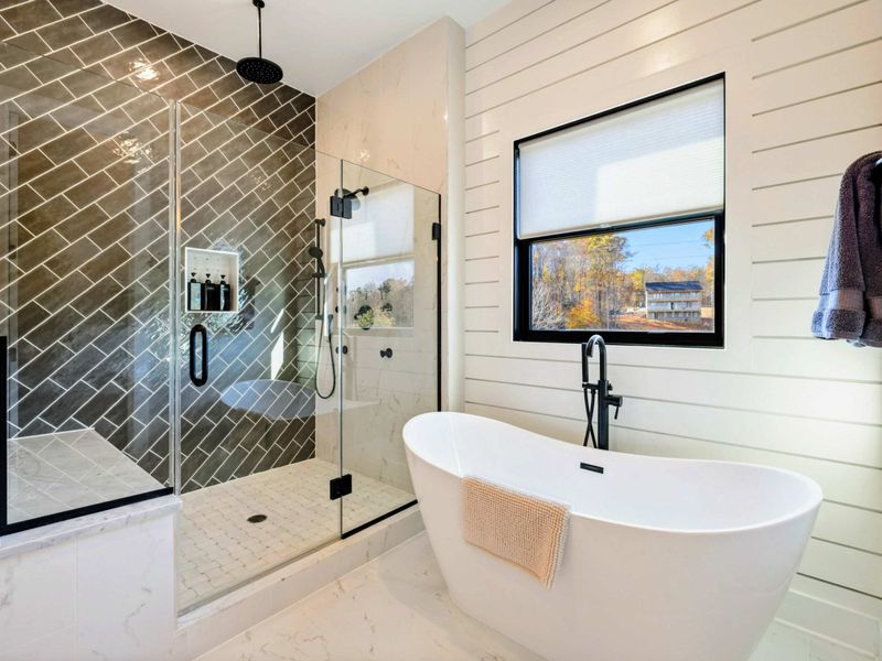 Primary Bath - Alternate angle showing the shower, tub, and vanity arrangement.