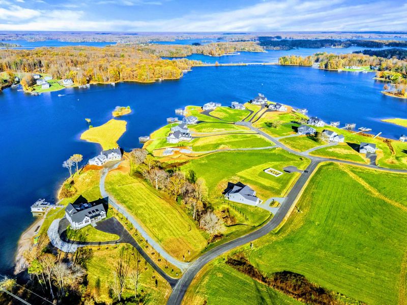 Aerial View - Overhead perspective of the lakeside community with the property in the foreground.