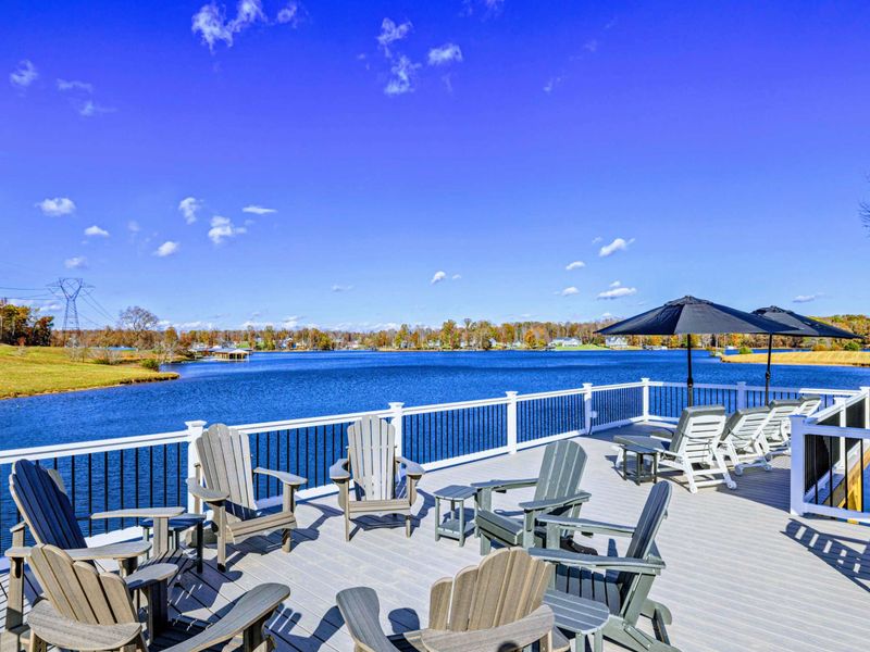 Dock - Upper level of the two-tier dock with sun loungers and shaded seating.