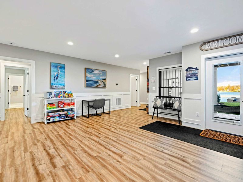Exterior - Entry foyer with bench seating, board games, and a view through to the great room.
