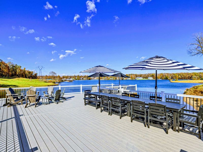 Dock - Evening light on the floating deck with cushioned seating facing the lake.