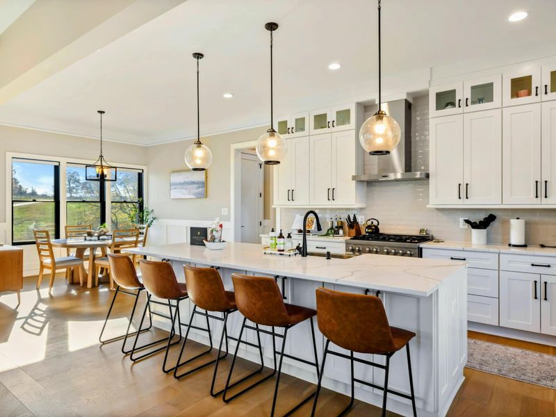 Kitchen - Wide shot of the kitchen connecting seamlessly to the great room.