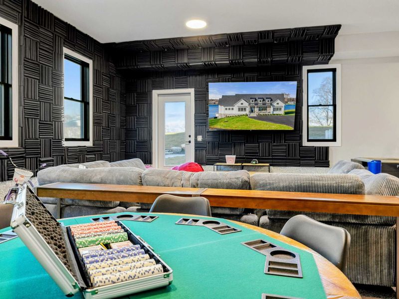 Game Room - Ping-pong table and TV lounge area within the game space.