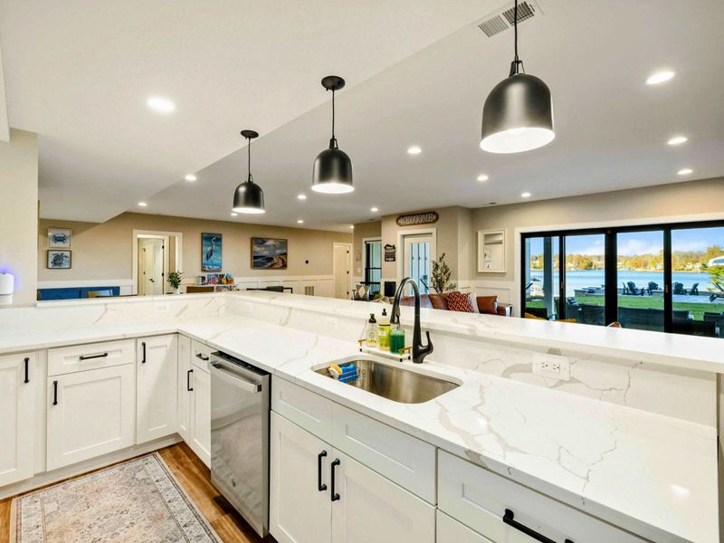 Lower Kitchen - Stovetop and counter workspace with modern fixtures.
