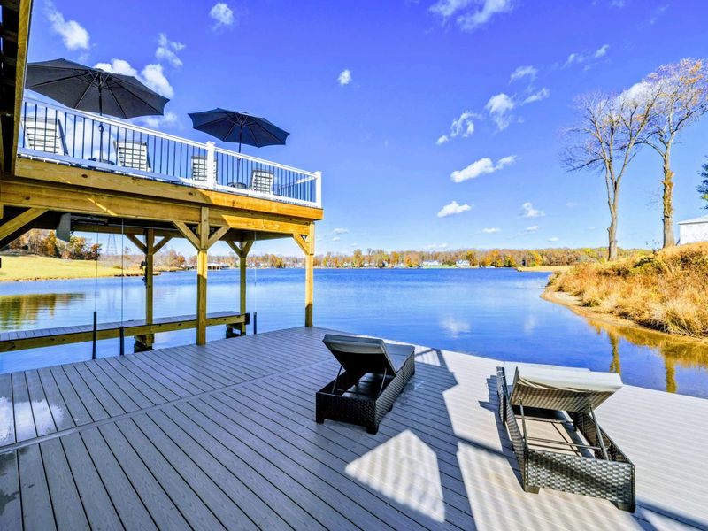 Dock - Lower deck with sun loungers overlooking the lake.