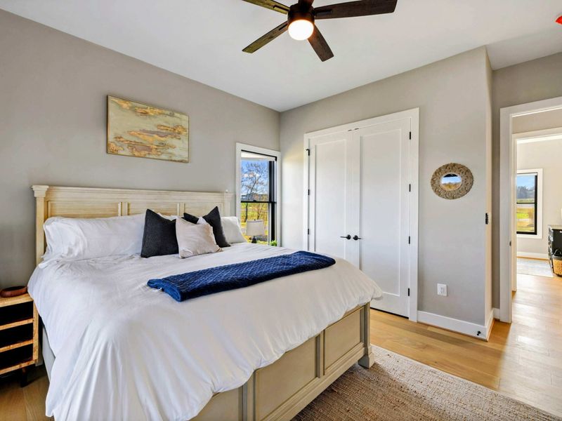 Bedroom 4 - Detail of the bedside decor and balcony door.