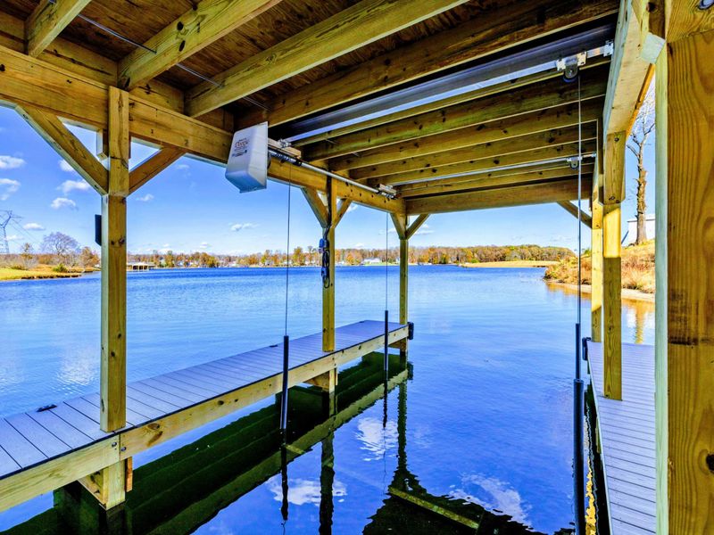 Dock - Covered dock with boat slips and casual seating.