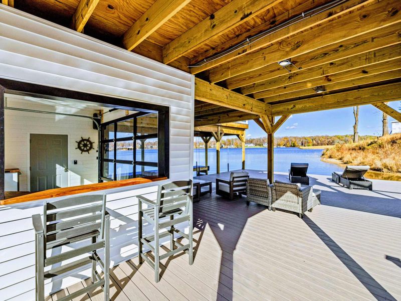 Dock - Covered bar and lounge under the dock roof with lake views.