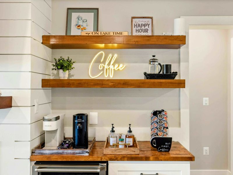 Lower Living Area - Detail of the coffee bar arrangement and fireplace surround.