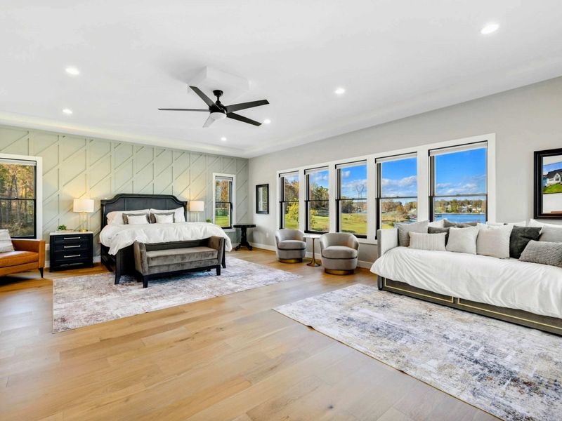 Primary Suite - Daybed tucked beside the main bed with a throw blanket and pillows.
