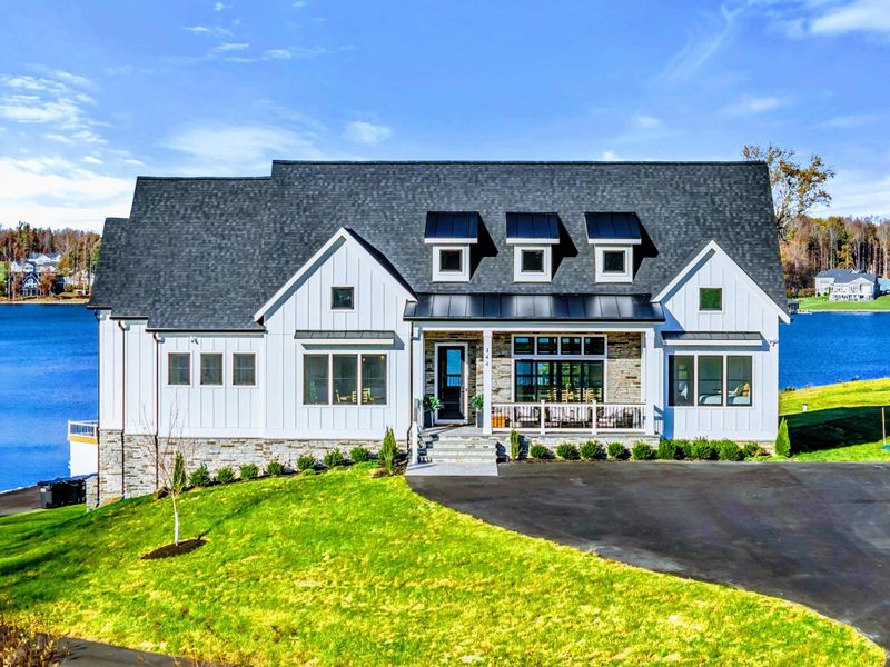 Exterior - Farmhouse and waterfront viewed from further out on the lake.