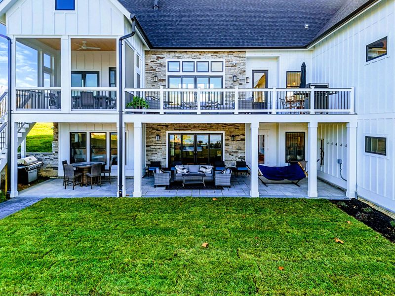 Backyard - Two-level outdoor living with covered patio below and open deck above.