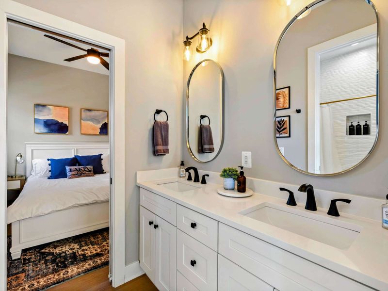 Jack and Jill Bath - Dual sinks, elegant lighting, and seamless access from both bedrooms.