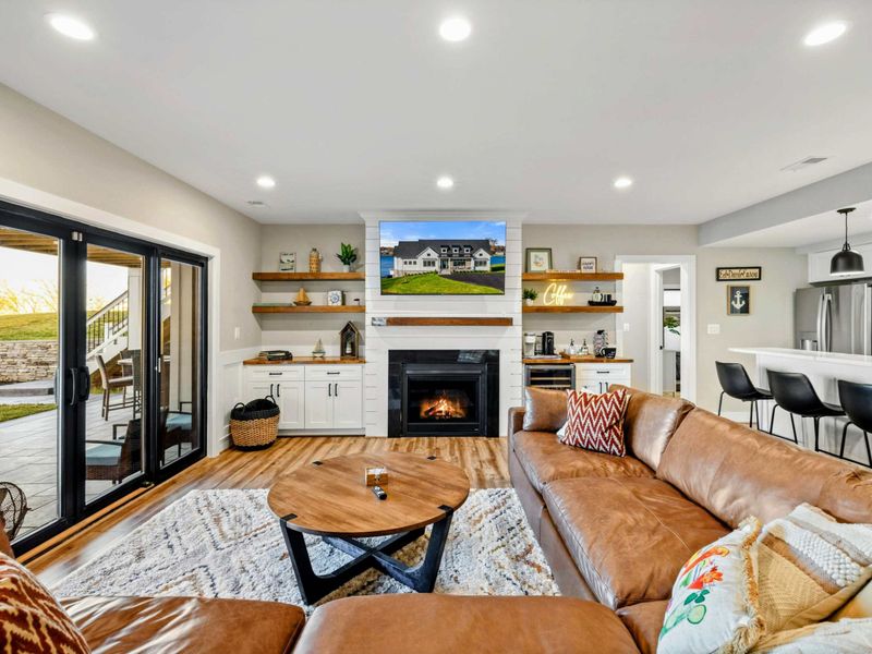 Lower Living Area - Fireplace, large sectional, and sliding door access to the backyard.