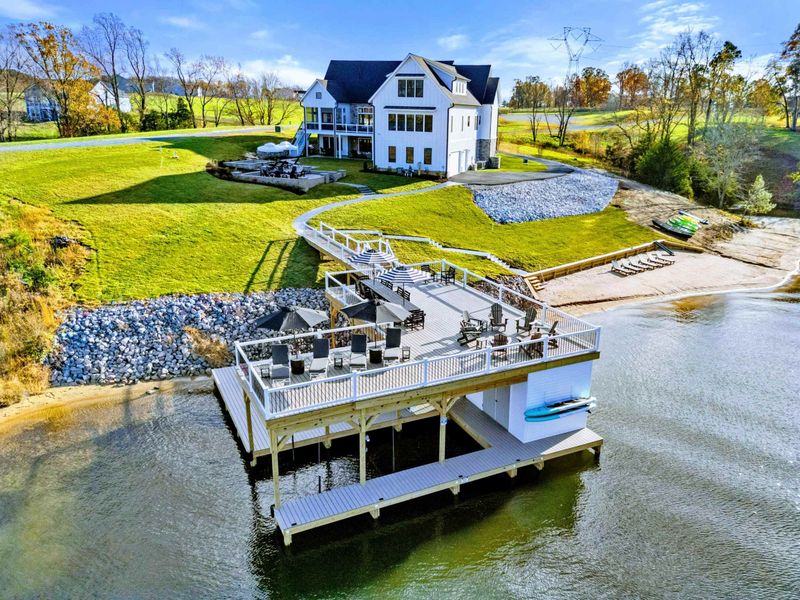 Dock - Floating platform with lounge seating, umbrellas, and panoramic lake views.
