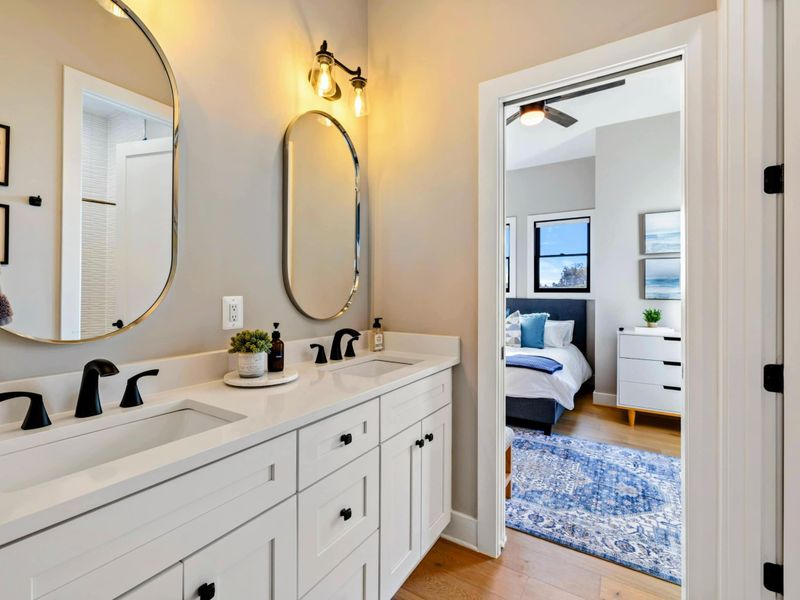 Jack and Jill Bath - Full view showing the vanity, shower, and dual-entry layout.