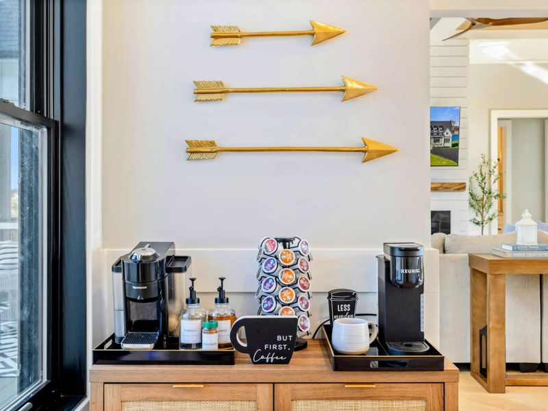 Kitchen - Coffee station with pod brewer, mugs, and a curated selection of blends.