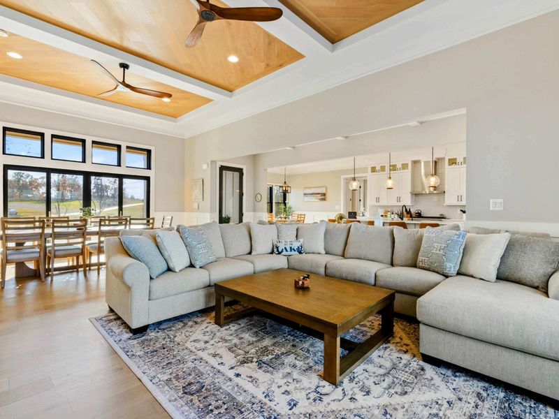 Great Room - Open-concept space connecting the sectional seating, dining, and kitchen.