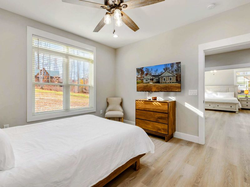 Cozy bedroom with a comfortable bed, modern furnishings, and an en suite bathroom for added privacy and convenience.