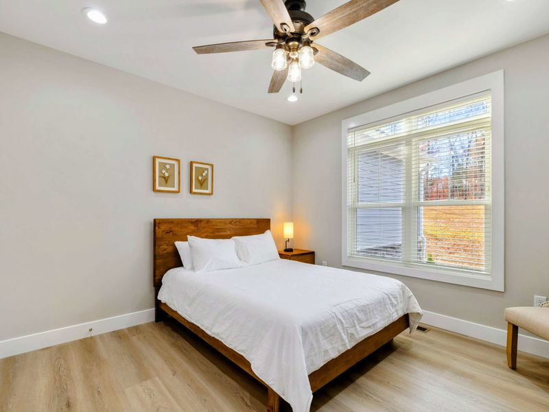 Cozy bedroom with a comfortable bed, modern furnishings, and an en suite bathroom for added privacy and convenience.