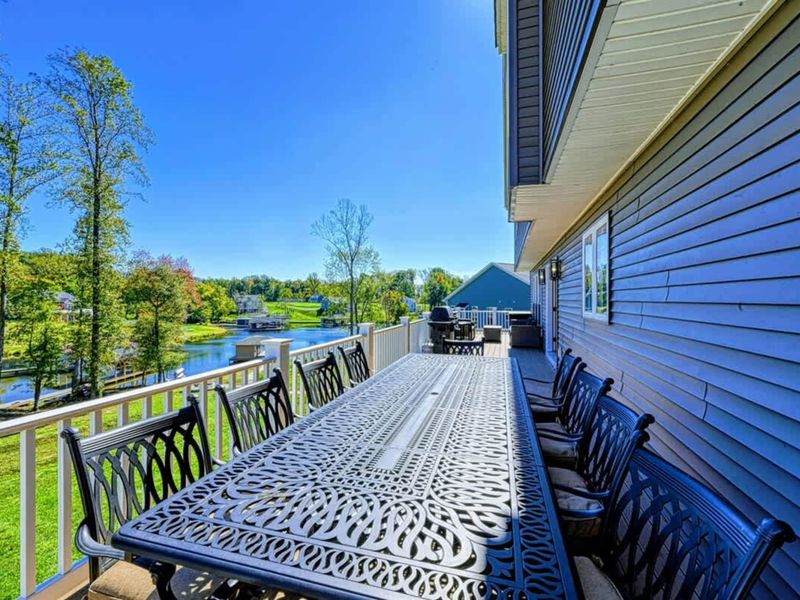 Upper Deck - A long table built for the whole group, served outside with the lake as the view.