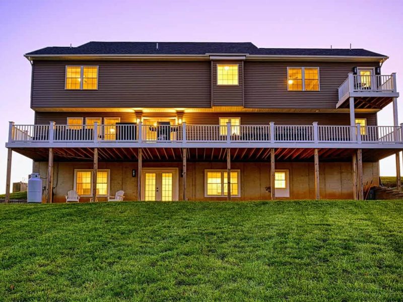 Aerial View - The full property from above: lake position, dock, multiple decks, room for sixteen.