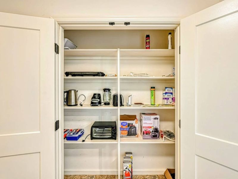 Pantry - Small appliances and essentials stocked, ready for everything from morning coffee to late-night snacks.