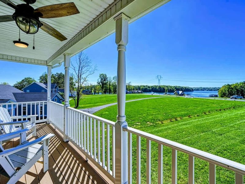Screened Balcony - Ceiling fan, lake views, the porch where the afternoon naps happen.