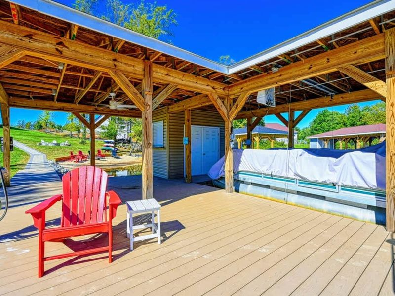 Covered Dock - Shade, seating, and a slide. Built for the long lake afternoon.
