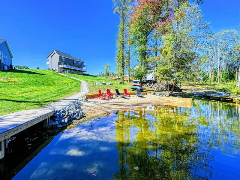 Private Beach - A rare stretch of sand on Lake Anna's quiet side, lounge chairs in place.