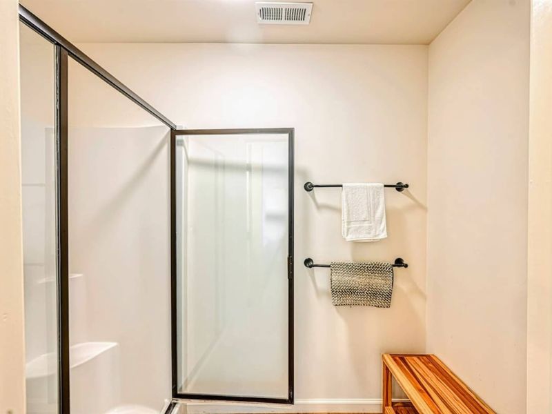 Primary Bath - Double vanity, walk-in shower, finishes that feel more spa than functional.