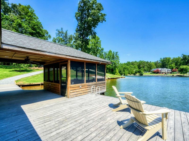Beautiful lakefront boathouse with panoramic water views.