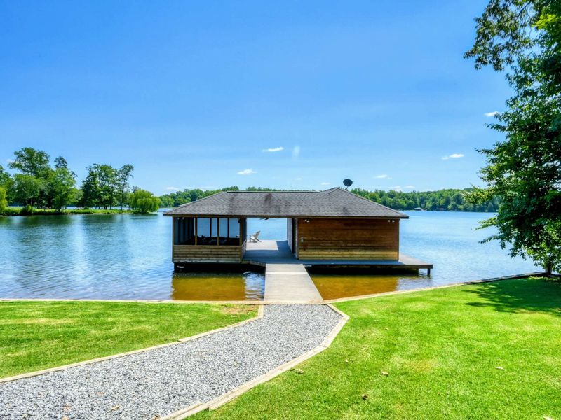 Beautiful lakefront boathouse with panoramic water views.