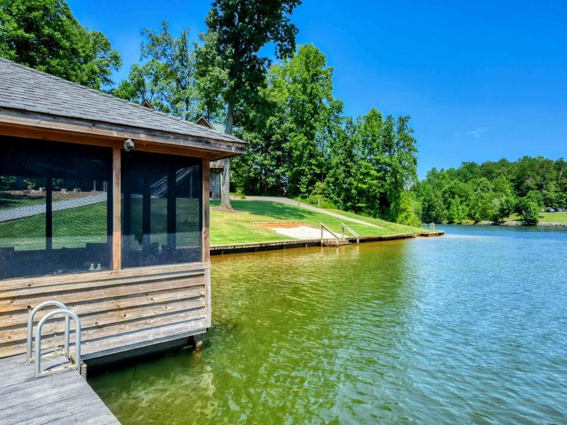 Beautiful lakefront boathouse with panoramic water views.
