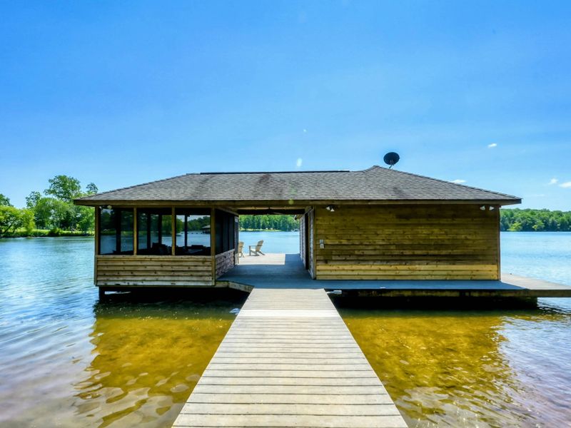 Beautiful lakefront boathouse with panoramic water views.