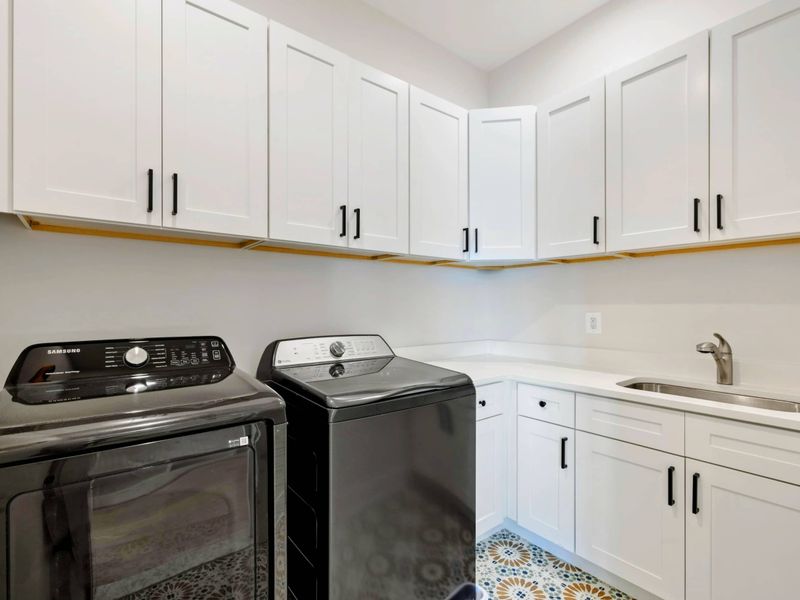 Laundry Room - Full-size washer and dryer, deep utility sink, and ample cabinetry for a long lake stay.