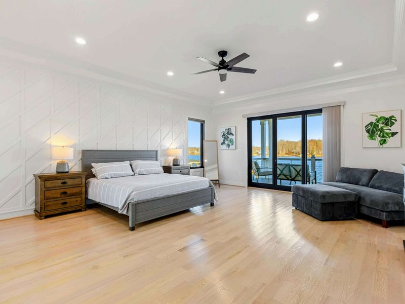 Suite #1 - Primary - King bed, lake-view doors that open onto a private balcony, sofa to lounge after the day winds down.