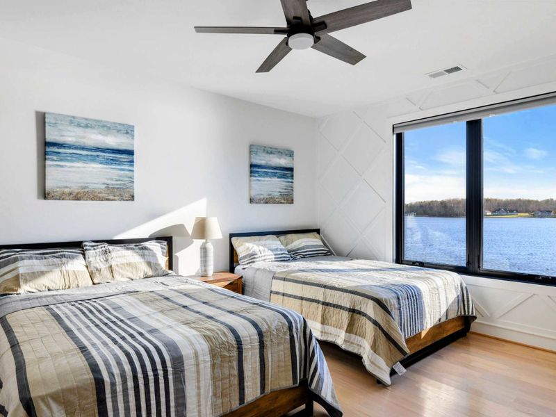 Suite #4 - Two queen beds, lake-view windows, and an ensuite tucked just off the bed.