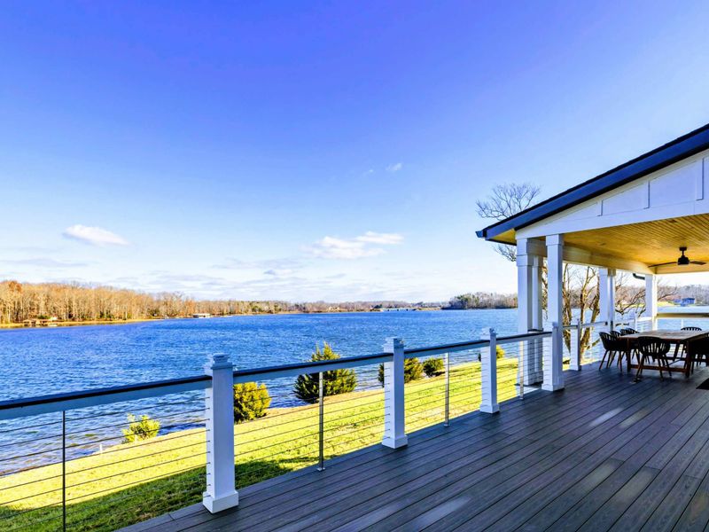 Balcony - Wide-plank deck with rail-top dining and unobstructed lake views. Morning coffee with the cove stretching out in front of you.