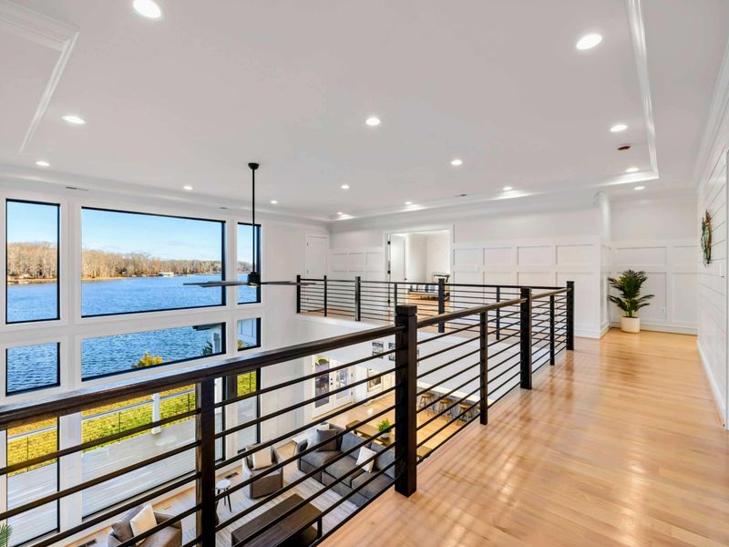 Loft Overlook - Upstairs walkway above the great room with rail-top views of the lake and the room below.