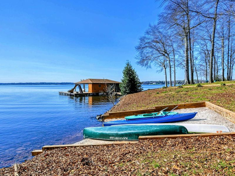 Peaceful lakeside beach, perfect for launching kayaks and canoes.