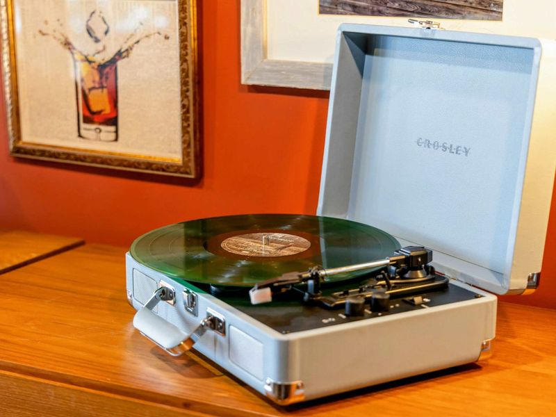 The record player provides a nostalgic vibe and a cozy ambiance in the space.