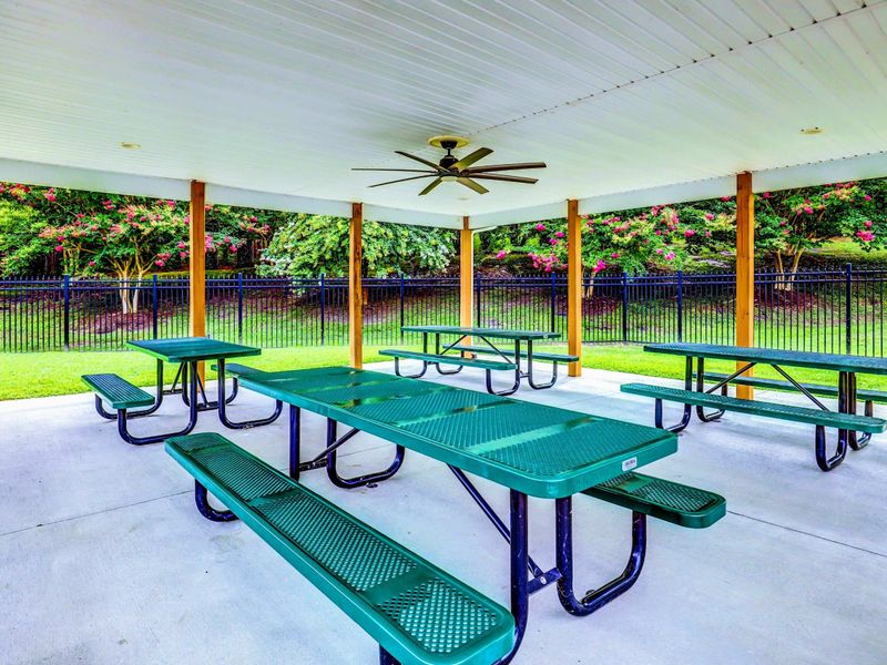 The rental includes access to The Waters community amenities, including a marina, swimming pool, tennis courts, picnic pavilions, a playground, and a sandy beach with lakefront views.