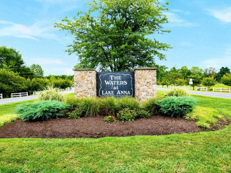 The rental includes access to The Waters community amenities, including a marina, swimming pool, tennis courts, picnic pavilions, a playground, and a sandy beach with lakefront views.