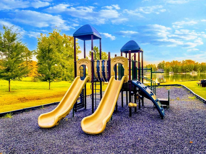 The rental includes access to The Waters community amenities, including a marina, swimming pool, tennis courts, picnic pavilions, a playground, and a sandy beach with lakefront views.