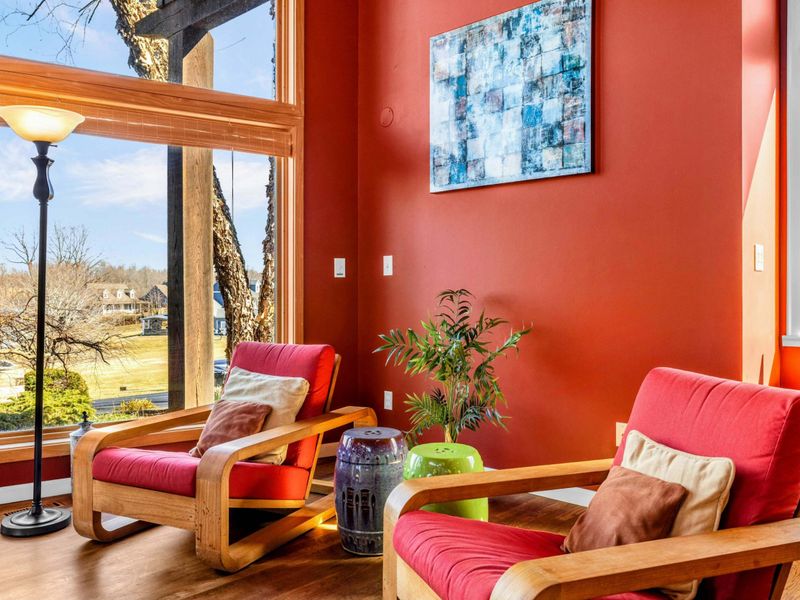 Relax in this bright and inviting corner with stylish chairs, warm decor, and stunning lake views. Perfect for morning coffee, reading, or unwinding while enjoying the natural beauty of Lake Anna.