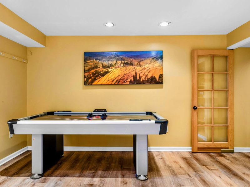 Challenge friends and family to a game of air hockey in this spacious entertainment area. A perfect spot for friendly competition and fun-filled moments during your Lake Anna getaway!