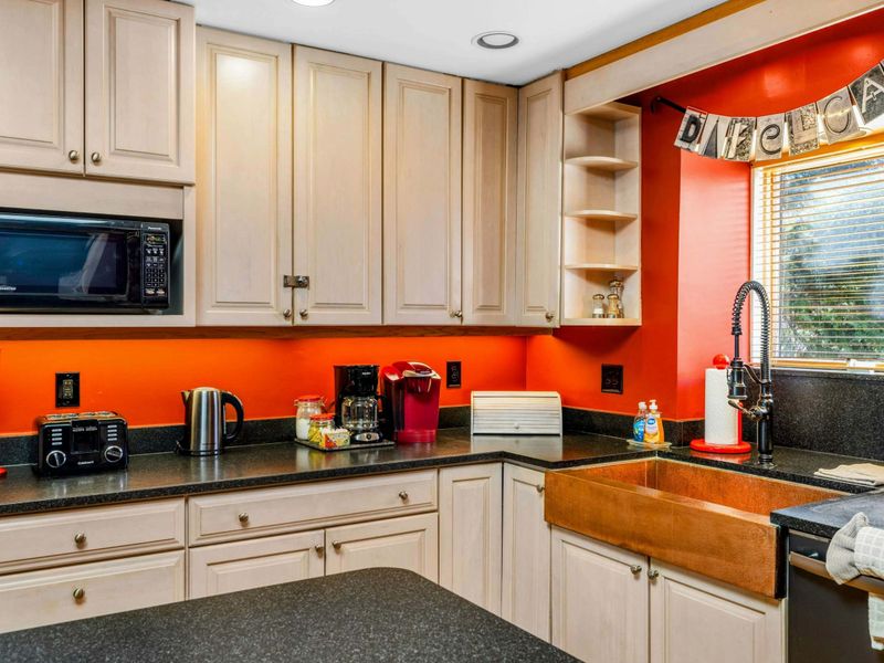 Charming & Fully Equipped Kitchen - This inviting kitchen features a farmhouse sink, modern appliances, and plenty of counter space. Enjoy the convenience of a Keurig, toaster, and microwave, making meal prep effortless during your stay.