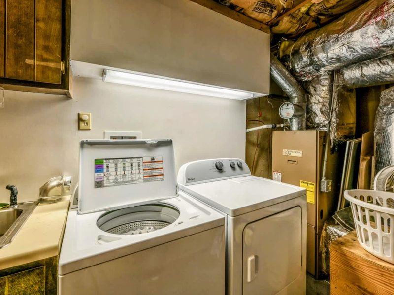 Stay connected and organized with the modern laundry room, complete with appliances to meet all your needs.