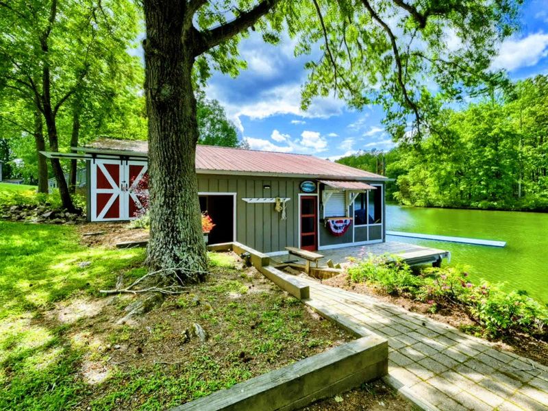 Enjoy a rustic escape with this charming boathouse, set against the stunning backdrop of Lake Anna.